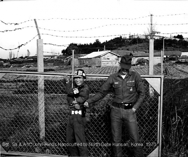 A1C John Hinds handcuffed to Sgt. Sa