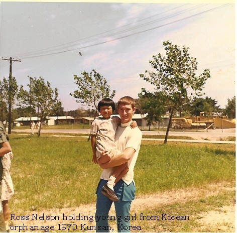 A1C Ross Nelson with girl from orphanage